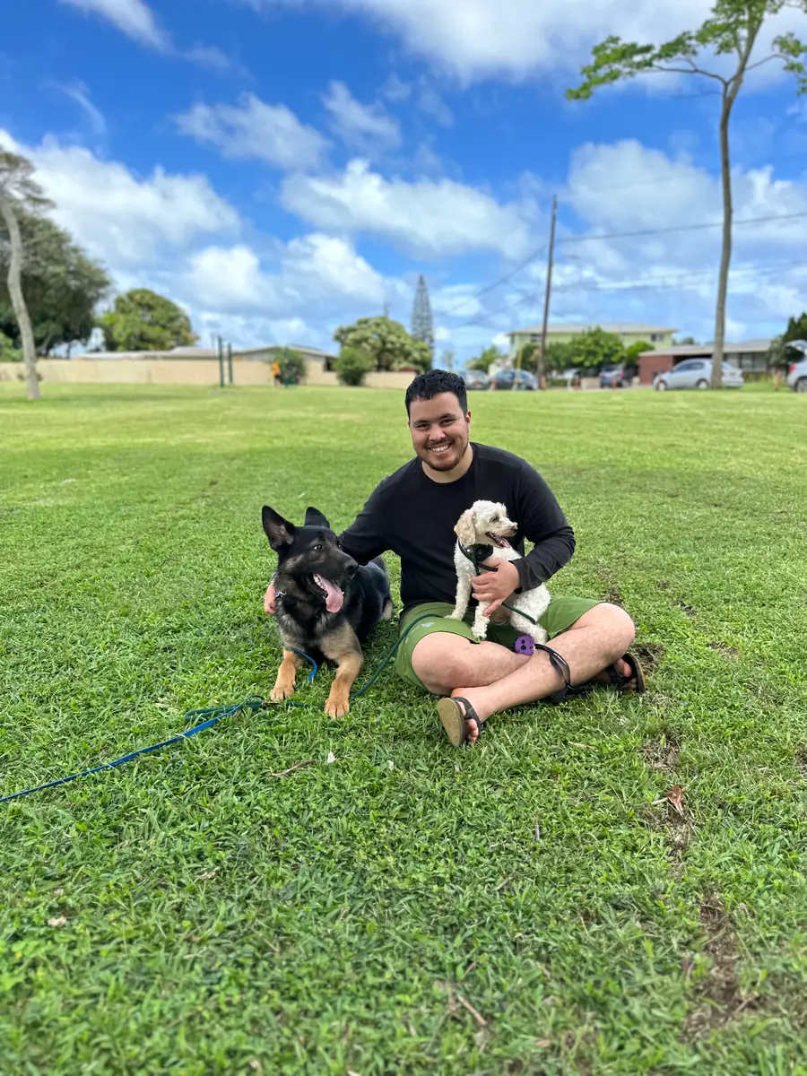 Lokahi training a dog on a Hawai'i farm
